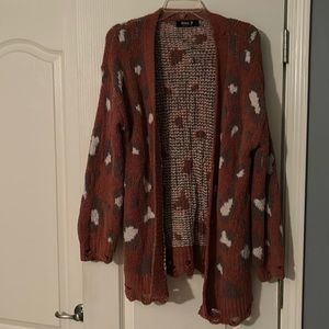 Boutique sweater. Super soft. Distressed around wrists and bottom hem.